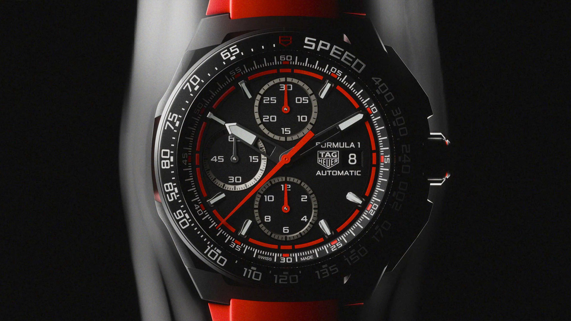 TAG Heuer Formula 1 automatic watch with red and black design, multiple dials, and date display on a bold red strap at LVMH Watch Week.